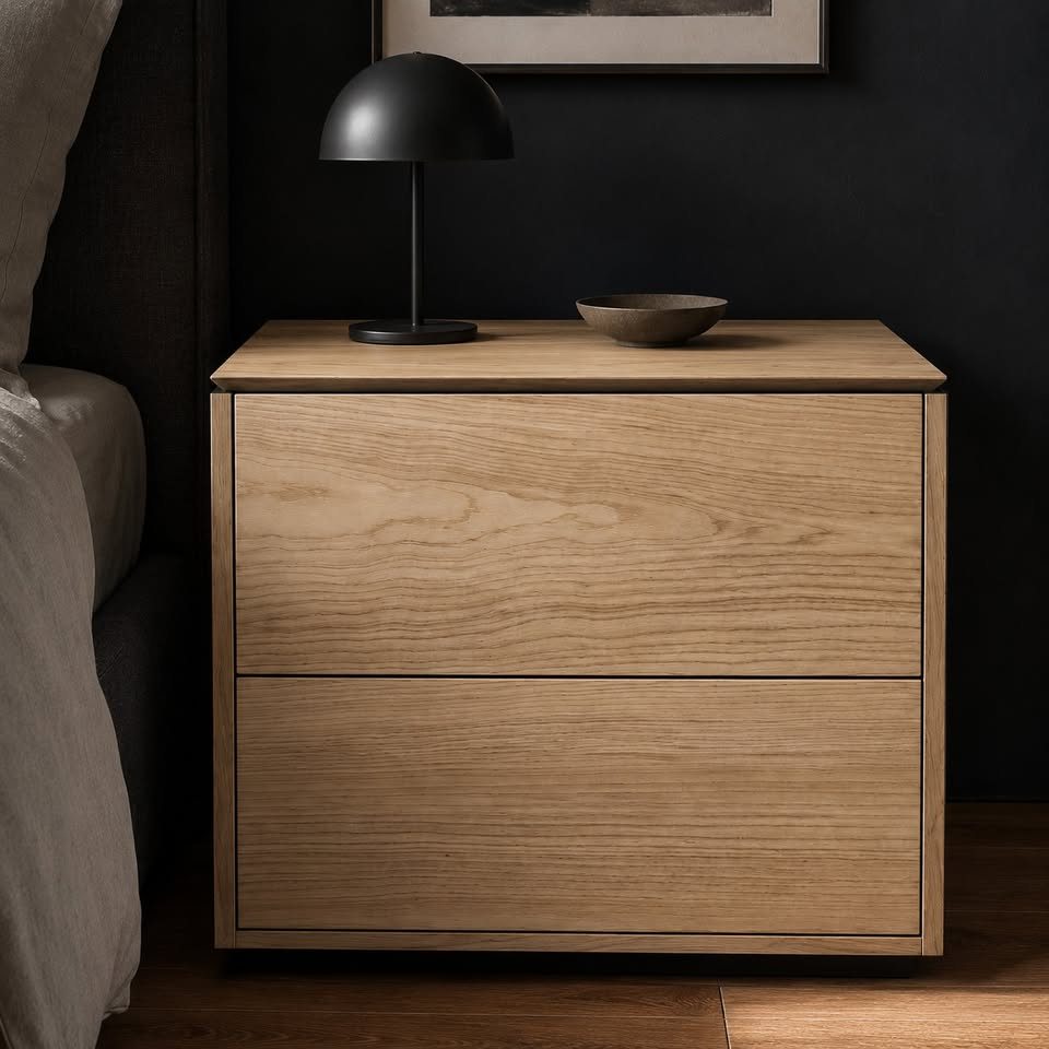 Solid ash two-drawer nightstand with black pulls and clean modern lines.